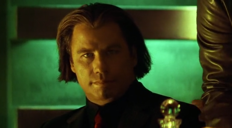 Travolta in an unconvincing wig